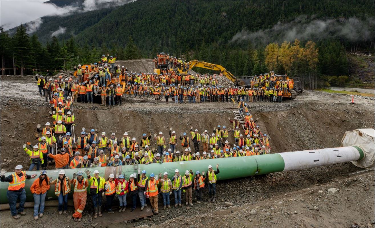 coastal gaslink pipeline completion. photo of workers around pipe.